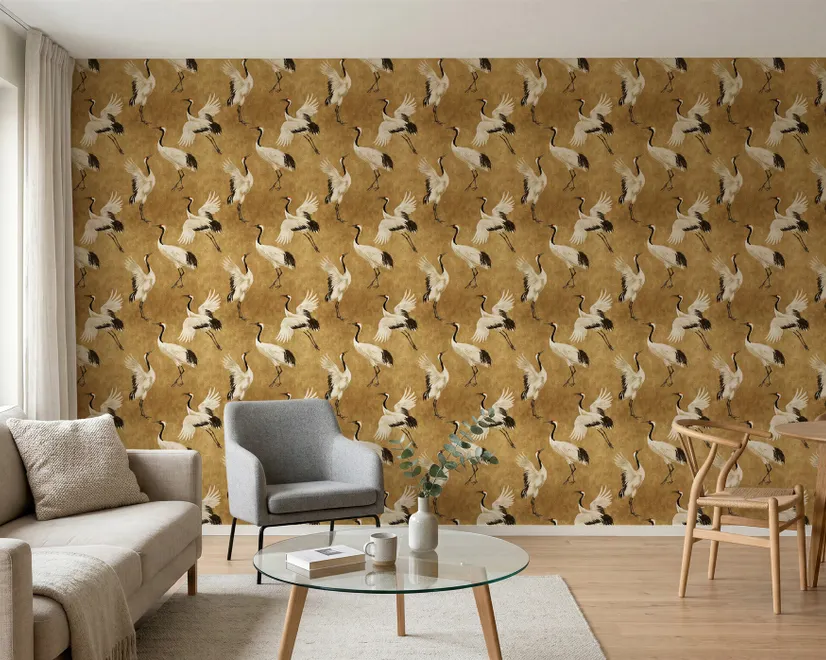 Japanese crane wallpaper with white, black and red cranes in flight on an antique-gold textured ground