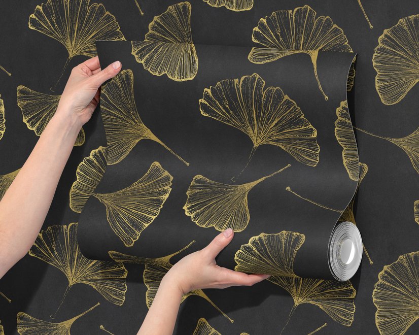 Black wallpaper with antique metallic gold ginkgo leaves on a mottled charcoal ground