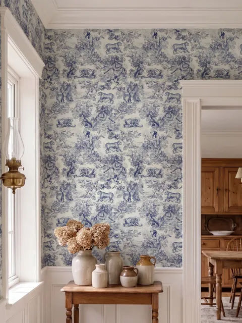 Jungle wallpaper with animals in navy toile, showing tigers, elephants and monkeys on an ivory cream ground