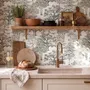 Monochrome wallpaper with grey tree toile on a clean white ground