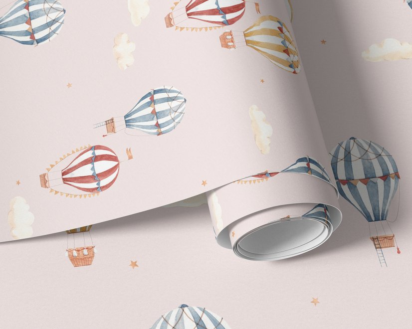 Hot air balloon nursery room wallpaper with watercolour balloons, clouds and stars on a soft blush-pink ground