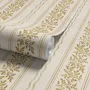 Gold and white wallpaper with antique gold leafy sprig stripes on parchment cream