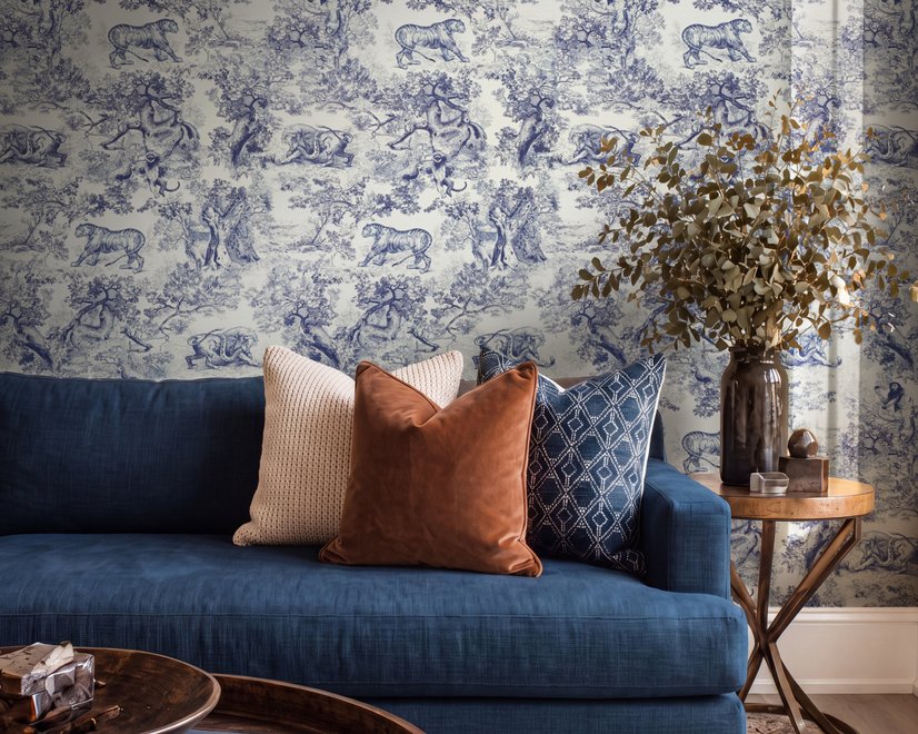 Jungle wallpaper with animals in navy toile, showing tigers, elephants and monkeys on an ivory cream ground