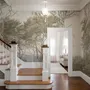 Tree wallpaper forest mural with olive coastal woodland, bare branches, shoreline path and small sailboats