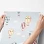 Hot air balloon wallpaper with watercolor balloons, ivory clouds and peach gold stars on pale powder blue