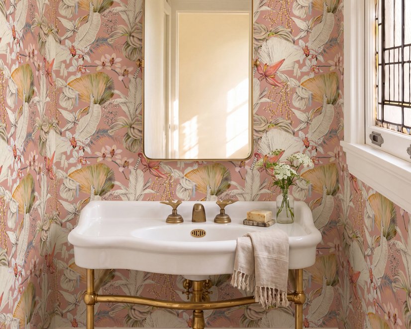 Pink tropical wallpaper with ivory fan palms, orchids, coral blossoms and sage foliage on dusty rose