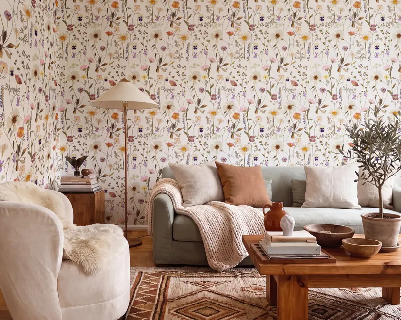 Cute spring wallpaper with pressed ivory, pink, blue and yellow wildflowers on a white ground