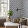 Cream colored wallpaper with denim blue geometric totem stripe repeat on a linen texture ground
