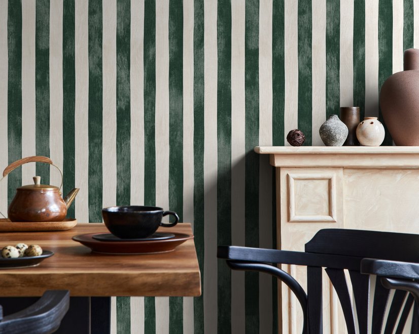 Green striped minimalist wallpaper with vertical deep forest green bands on a soft warm ivory ground.