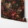 Dark moody floral wallpaper with cream peonies, coral lilies, berries and green foliage on chocolate brown
