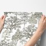 Monochrome wallpaper with grey tree toile on a clean white ground