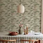 Vintage bamboo wallpaper with sage and smoky blue-green leaves on a warm taupe ground