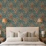 Blue tropical wallpaper with hibiscus, orchids, lilies, monstera leaves and palm fronds on a deep teal-blue ground