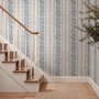 Blue wallpaper with indigo botanical stripework, pinstripes and dotted borders on warm cream parchment