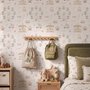 Children's playroom wallpaper with pastel Ferris wheel, carousel horses, tents and balloons on blush pink