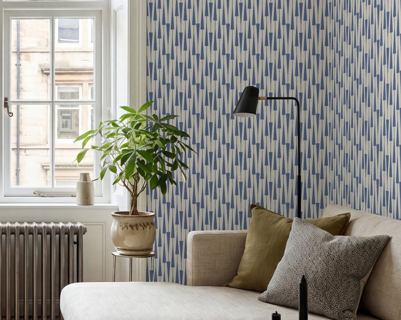 Cream colored wallpaper with denim blue geometric totem stripe repeat on a linen texture ground