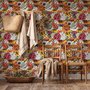 Floral and fish wallpaper with coral blooms, teal fish and black white flowers on metallic mustard-gold ground