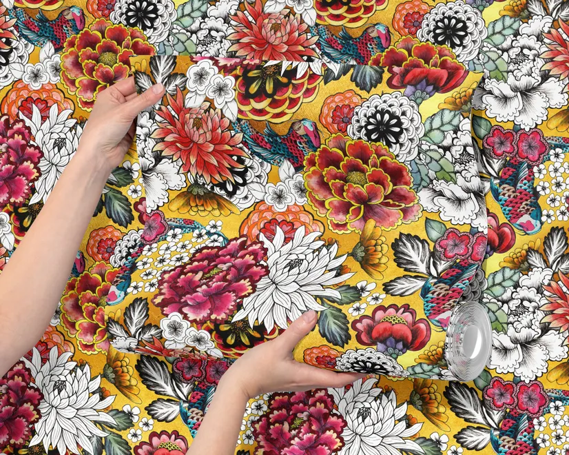 Floral and fish wallpaper with coral blooms, teal fish and black white flowers on metallic mustard-gold ground