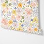 Spring floral wallpaper with pastel watercolour flowers and sage leaves on a clean white ground