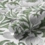 Sage green botanical floral wallpaper with white poppy flowers, lobed leaves and dotted seed centres