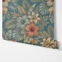 Blue tropical wallpaper with hibiscus, orchids, lilies, monstera leaves and palm fronds on a deep teal-blue ground