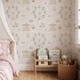 Children's playroom wallpaper with pastel Ferris wheel, carousel horses, tents and balloons on blush pink