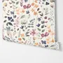 Watercolour floral wallpaper repeat with navy, blue, blush and peach wildflowers on warm cream