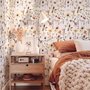 Cute spring wallpaper with pressed ivory, pink, blue and yellow wildflowers on a white ground