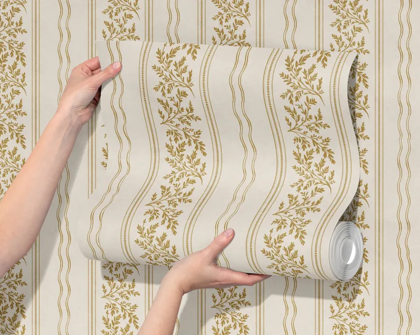 Gold and white wallpaper with antique gold leafy sprig stripes on parchment cream
