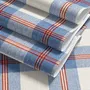 Blue and red plaid wallpaper with denim blue, cream and sky blue woven checks and fine red stripes