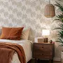 Muted sandy taupe palm trees and pale foliage on a creamy ivory ground tropical wallpaper