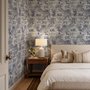 Jungle wallpaper with animals in navy toile, showing tigers, elephants and monkeys on an ivory cream ground