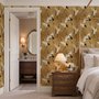 Japanese crane wallpaper with white, black and red cranes in flight on an antique-gold textured ground