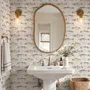 Watercolor fish wallpaper with trout, seashells and pale aqua washes on a warm cream ground