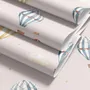 Hot air balloon nursery room wallpaper with watercolour balloons, clouds and stars on a soft blush-pink ground