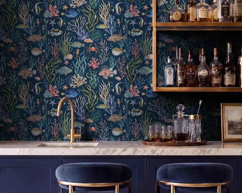 Aquarium fish tank wallpaper repeat with tropical fish, coral, seaweed, shells and bubbles on deep navy blue