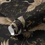 Ivory cranes and antique gold lotus flowers on charcoal-black Japanese lotus wallpaper