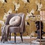 Japanese crane wallpaper with white, black and red cranes in flight on an antique-gold textured ground