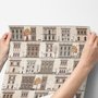 Vintage city wallpaper with illustrated European townhouses, lamps, bicycles, benches and orange-gold trees