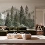 Misty mountain wallpaper mural with tall pine trees, layered green forest and pale foggy ridges