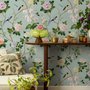 Chinoiserie wallpaper with peach birds, orchids and peonies on a pale duck egg blue ground