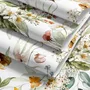 Watercolour floral wallpaper with sage leaves, blush and ochre flowers on a white ground