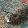 Blue tropical wallpaper with hibiscus, orchids, lilies, monstera leaves and palm fronds on a deep teal-blue ground