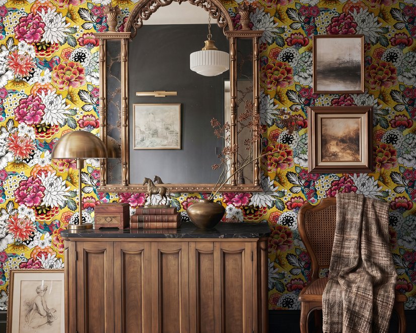 Floral and fish wallpaper with coral blooms, teal fish and black white flowers on metallic mustard-gold ground
