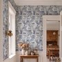 Jungle wallpaper with animals in navy toile, showing tigers, elephants and monkeys on an ivory cream ground