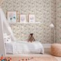 Pink wallpaper with watercolour blush, coral and yellow wildflowers, sage leaves and stems on a warm cream-white ground.