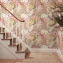 Pink tropical wallpaper with ivory fan palms, orchids, coral blossoms and sage foliage on dusty rose