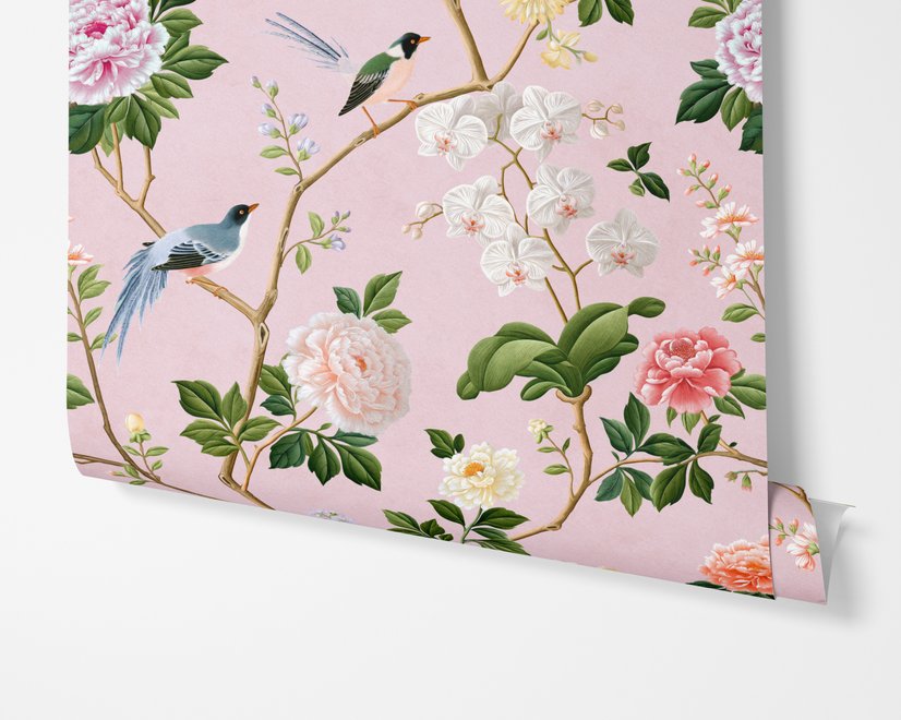 Cute pink wallpaper with birds, tan branches, green leaves and ivory, coral and lilac flowers.