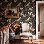 Ivory cranes and antique gold lotus flowers on charcoal-black Japanese lotus wallpaper