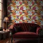Floral and fish wallpaper with coral blooms, teal fish and black white flowers on metallic mustard-gold ground